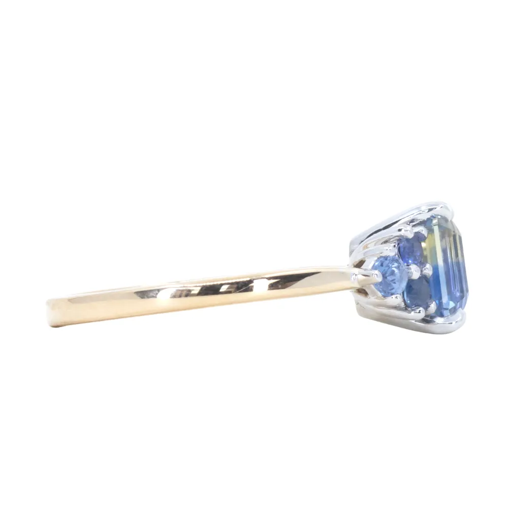 2.02ct Emerald Cut Bicolor Sapphire and Blue Sapphire Side Stone Cluster Ring in Two Tone 14k Yellow and White Gold