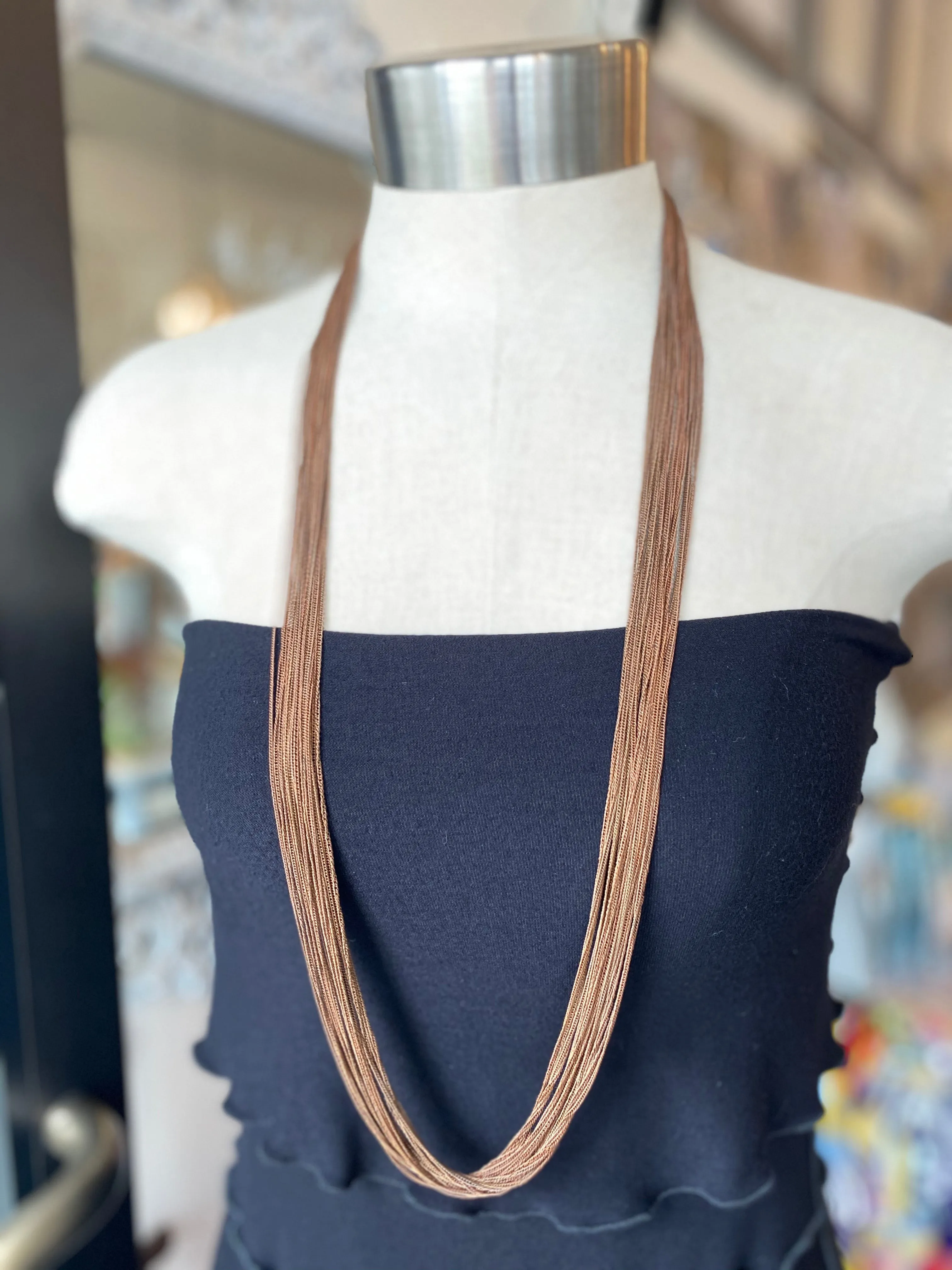 Multi chain long necklaces